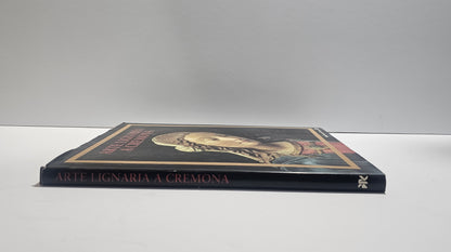 Copertina libro Arte lignea a Cremona tesori della Cattedrale dorso