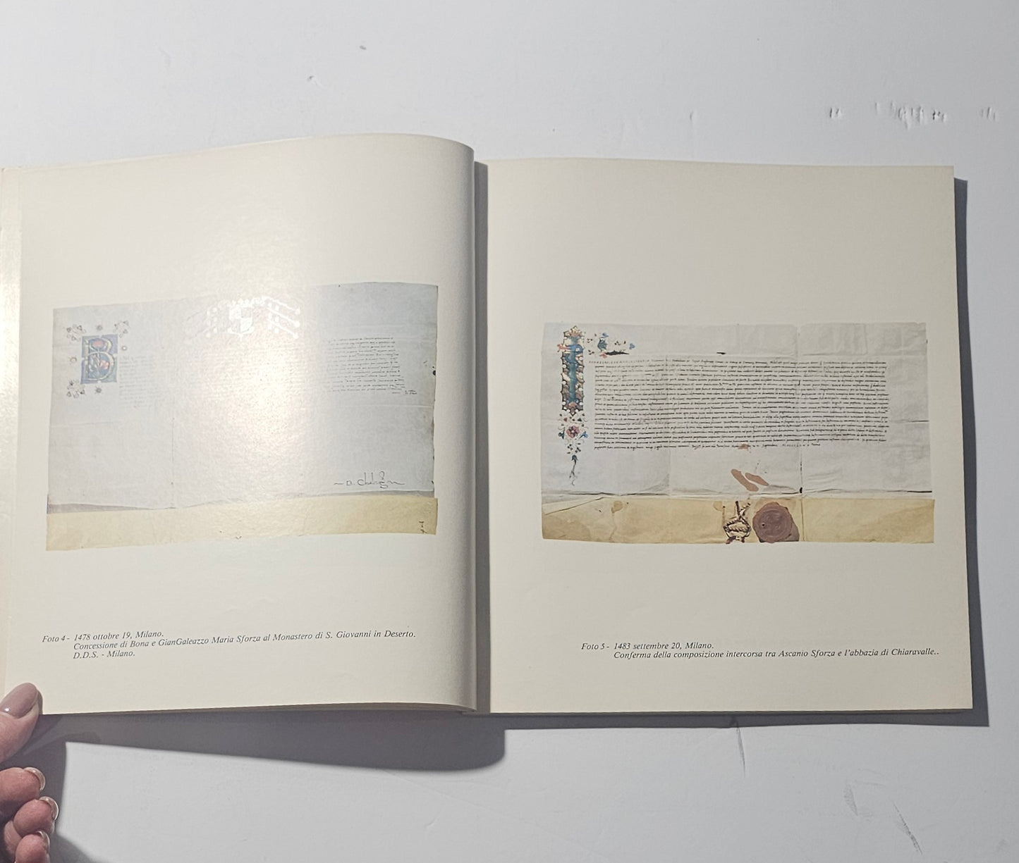 Pagine interne con documenti miniati e pergamene sforzesche io libro carmine